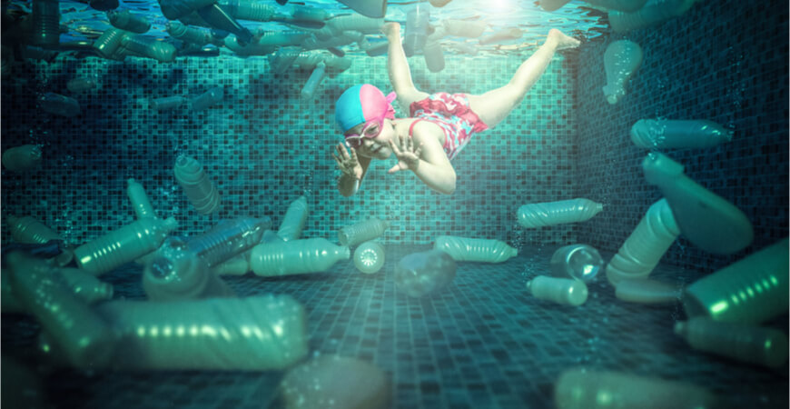 non-recycled plastic bottles and flasks around a diving girl